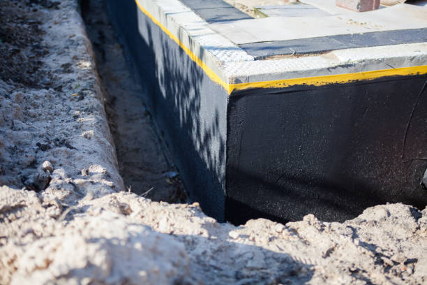 Professional Basement Waterproofing technician working in Fowlerton, IN